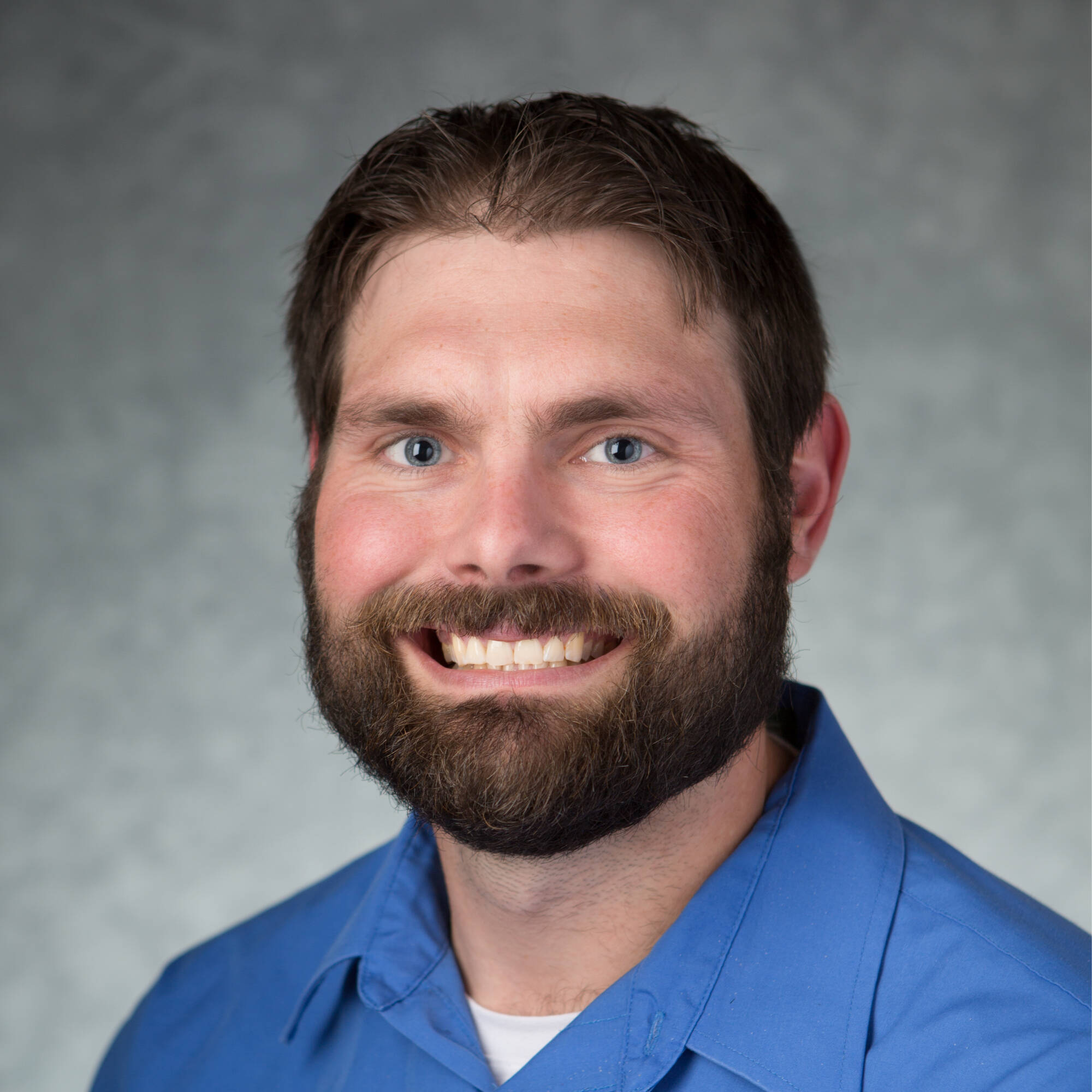 Nick Viau in blue button down shirt